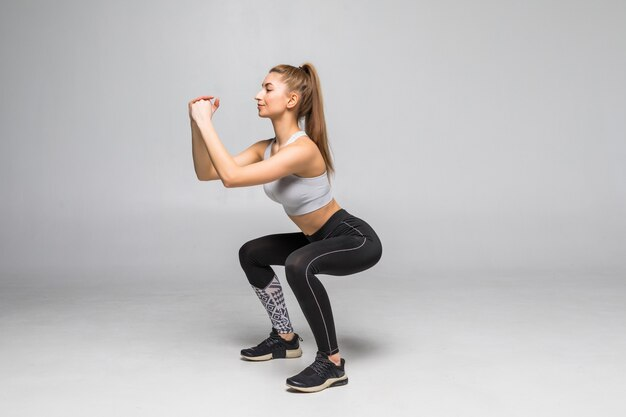 Woman doing Exercises Plie’ Squat